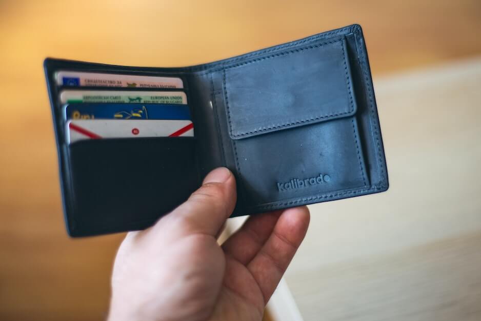 Open black wallet with cards in it