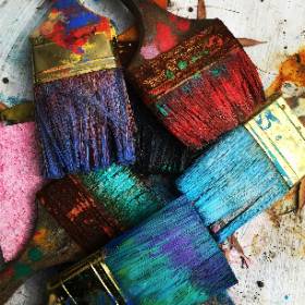 Colorful paintbrushes on white background